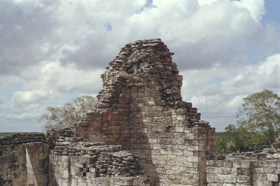 Becán: Residential courtyard with remains of vaulted rooms that once enclosed the courtyard on top of Structure IV