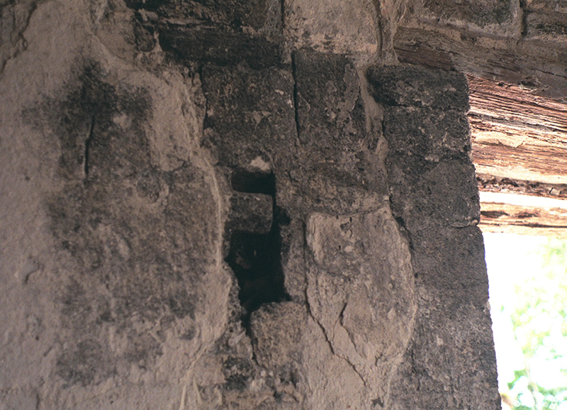 Interior view of Structure II showing the wooden lintel and cord holder used for hanging partitions