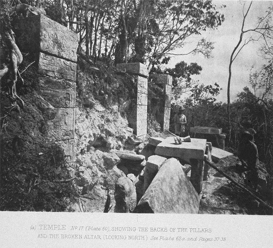 Maudslay’s 1889 photo of the top of the Temple of the Tables, showing the tables supported by Atlantean figures and three square columns with the rubble and vegitation choaking them