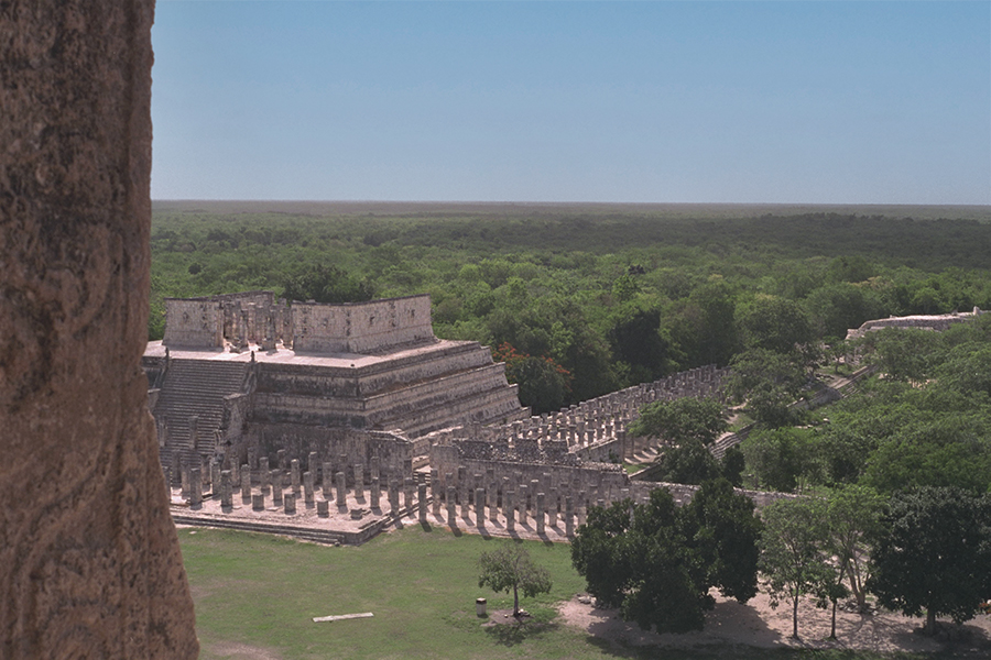 Photo of the reassembled columns of the North and West Colonnades seen from El Castillo