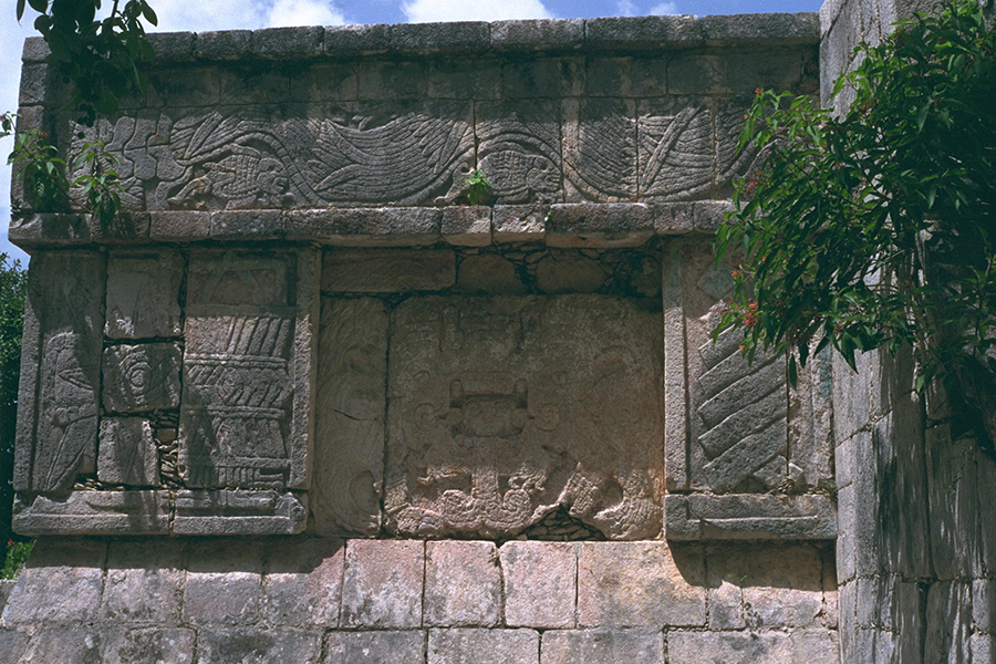 Modern photo of the reassembled Venus Platform detail showing a Vision Serpent plus a panel above showing a feathered serpent and fish