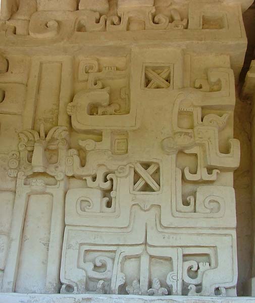 Stylized profile serpent head motif on Chenes Level 4 temple