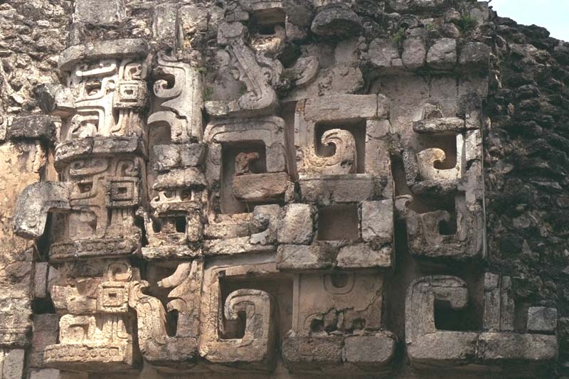 Profile view of stacked Chaac masks on the corner