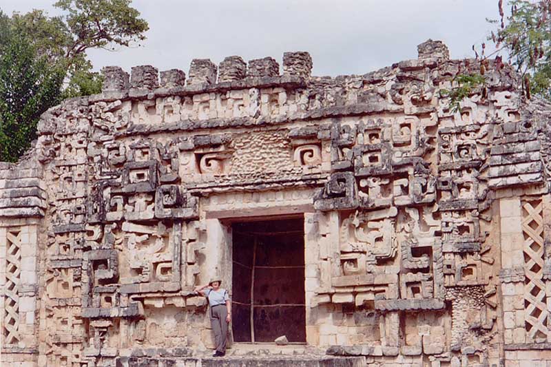 Visitor standing in the elaborate central zoomorphic doorway