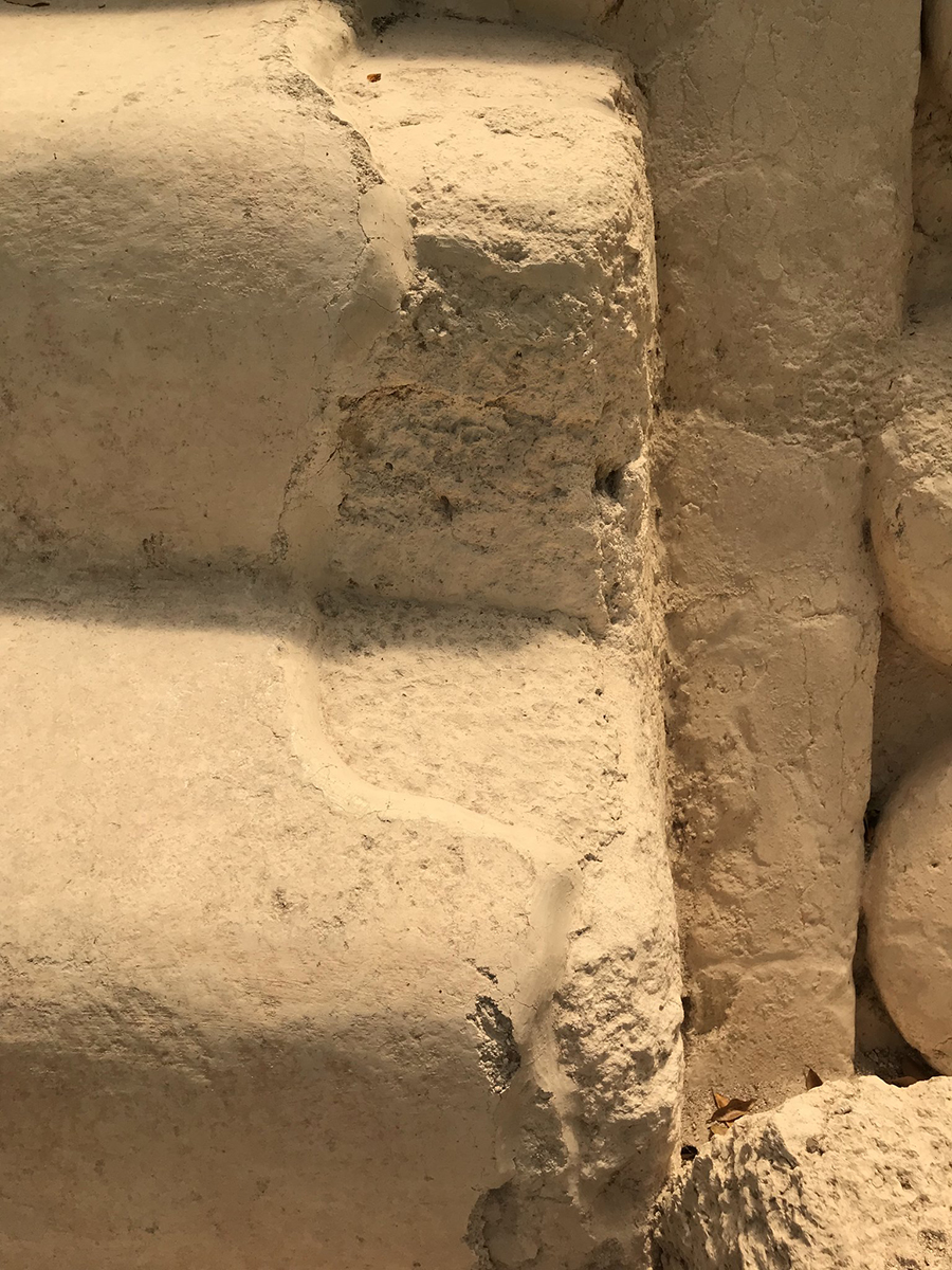 Photo of the stucco coating on a stair of Str 34 at El Mirador