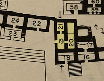 Closeup photo of giant Rain God mask above entrance to room 19 of the Palace of Labna