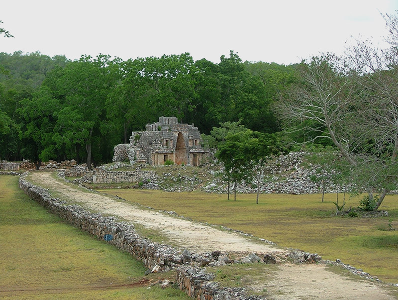 View looking south along the white stone sacbe toward the Mirador group at Labna