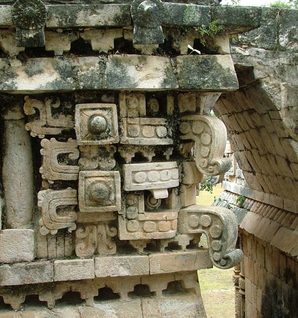 Stacked Chaac masks decorate the upper level of the Palace