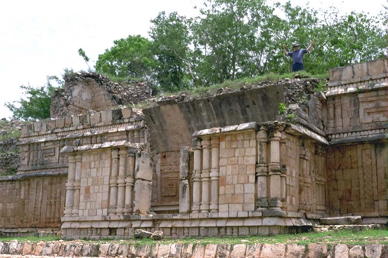 View through the antiroom doorway showing a volute design on the early throne room wall at Labna