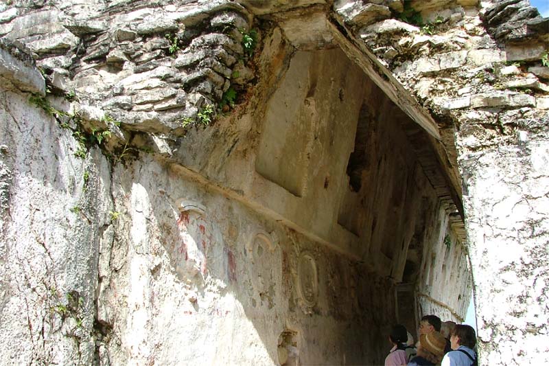 Interior stucco decoration and painted medallions in House A corridor