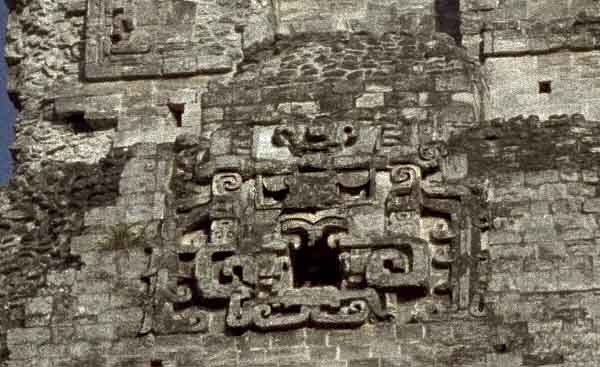 Xpujil: Feline mask on central tower with deity features and gaping jaws