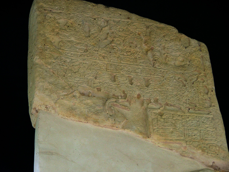 Upper register of Stela 1 showing a Skyband Monster and ancestors
