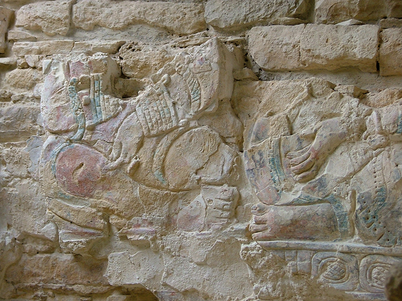 Detail of modeled stucco scene behind Stela 35