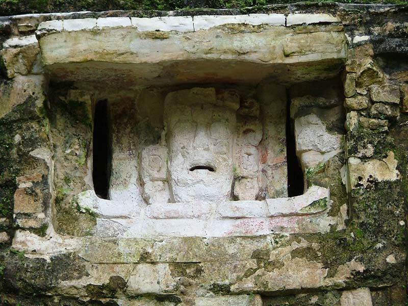 Human face panel in the eye of a monster mask on the foundation of Structure 6